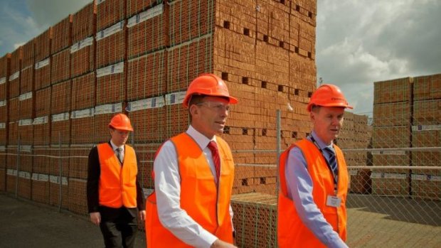 Tony Abbott tours the Sydney plant of Brickworks with its managing director, Liberal donor Lindsay Partridge, in September 2011. 