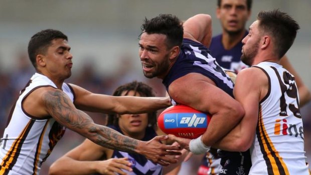 Ryan Crowley finds it hard to get into the clear against the Hawks.
