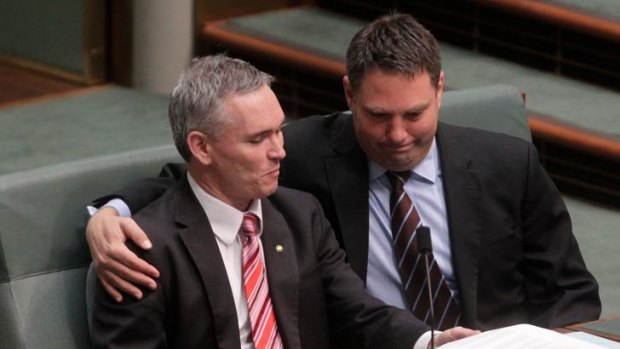 Craig Thomson is embraced by fellow ALP MP Richard Marles during a procedural vote, which was defeated, moved by the Opposition in an attempt to force Mr Thomson to address fellow MPs.