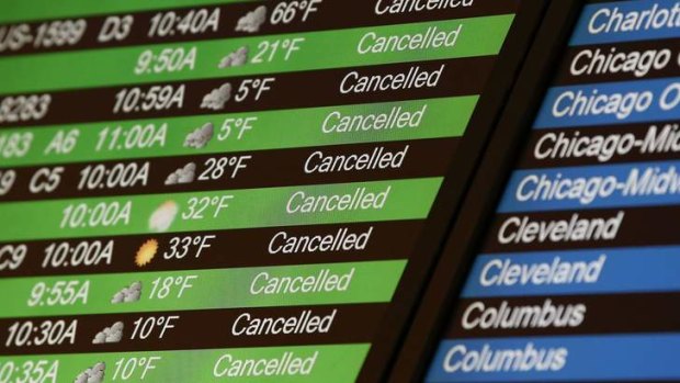 Flight cancellations on the board at LaGuardia Airport in New York.