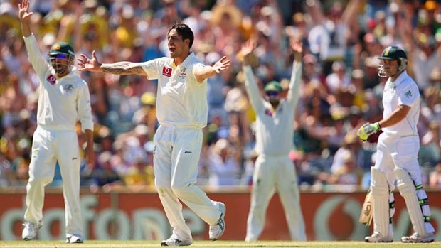 Mitchell Johnson successfully appeals for leg before to dismiss Dean Elgar.