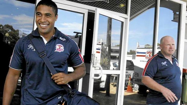 Michael Jennings leaves Roosters HQ on Wednesday with recruitment manager Peter O'Sullivan in the background.