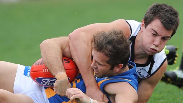 Grounded: Collingwood's Marley Williams tackles Bendigo's Mark McVeigh, who has been struggling to return to form.