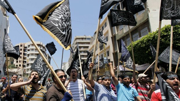 Lebanese Sunni Muslims Islamists protest in Beirut, after the killing of at least 108 people in the Syrian town of Houla.