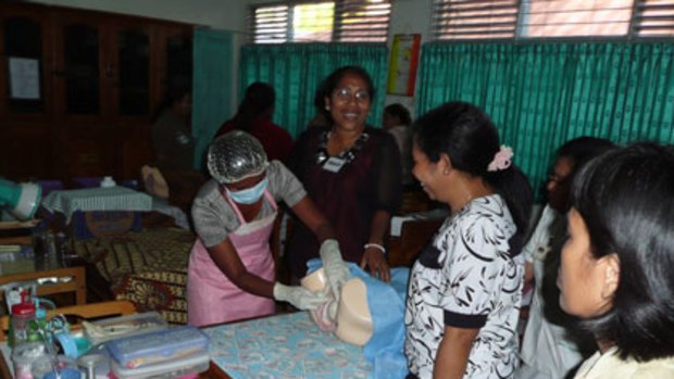 Midwife Yohana practises her technique with trainers at the clinic.
