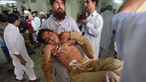 Relentless campaign ... men carry a victim of a suicide car bomb attack into hospital in the north-western city of Peshawar. The attack, in a city bazaar  10 days ago, killed 50 people.