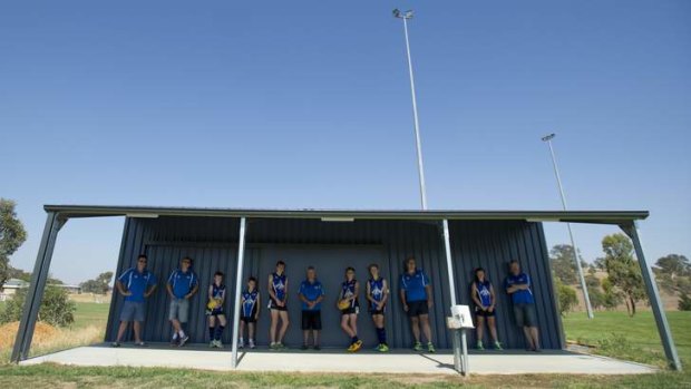 Gungahlin Jets Football Club members with the half built shed.