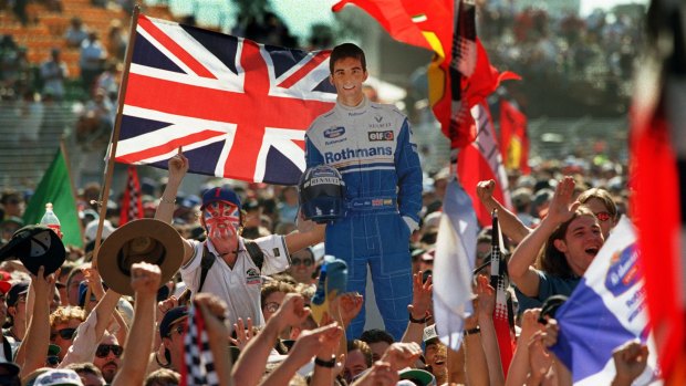 Fans holds up a cardboard cut out of Britain's Damon Hill, who won the 1996 Australian Grand Prix in Melbourne.