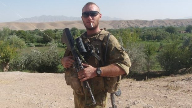 Heat of battle: Tom Williams takes a break on a 55-degree day while on patrol in the green zone of Afghanistan. Born into a military family, he served a rotation through Mirabad Valley in   Oruzgan Province.