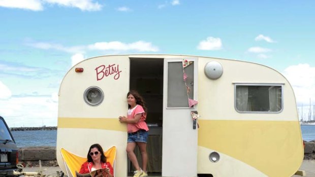 Home away from home ... Felicity Young and her eight-year-old daughter, Zara Tallulah, relax with Betsy, a 54-year-old Skyline Junior Bondwood caravan.