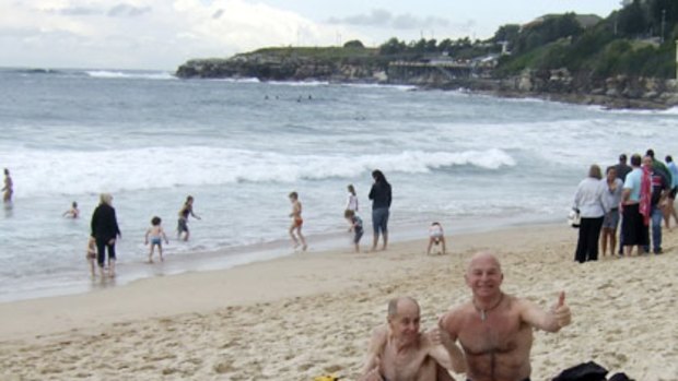 Defiance or an attempt to ease community fears? ...  Dennis Ferguson, left,  and Brett Collins at Coogee Beach. The photograph was provided to the  <i>Herald</i> by Mr Collins.