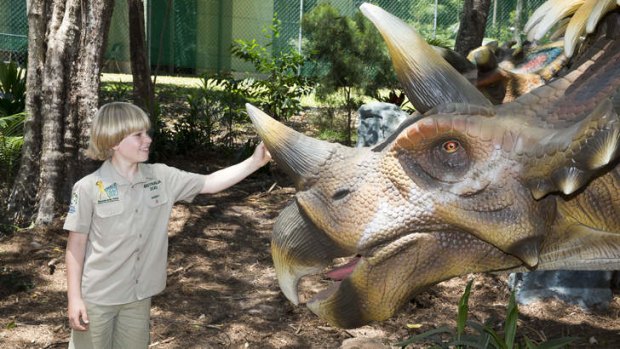 Robert Irwin  with a triceratops at Palmersaurus.