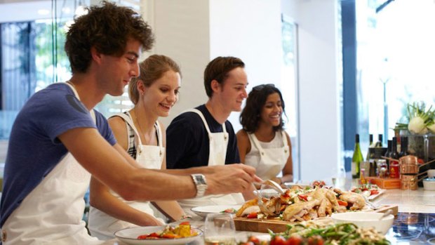 Students taste test the food at the Spring Brisbane cooking school.