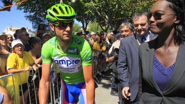 Under investigation . . . Italian sprinter Alessandro Petacchi rides alongside French Secretary of State for Sports Rama Yade on Monday.