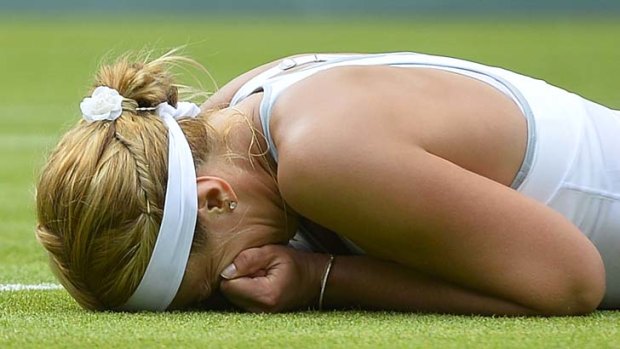 Sabine Lisicki of Germany celebrates after defeating Serena Williams at Wimbledon.