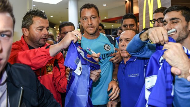Terry in Australia: Chelsea captain John Terry with Australian fans during his club's visit to Sydney in 2015. 