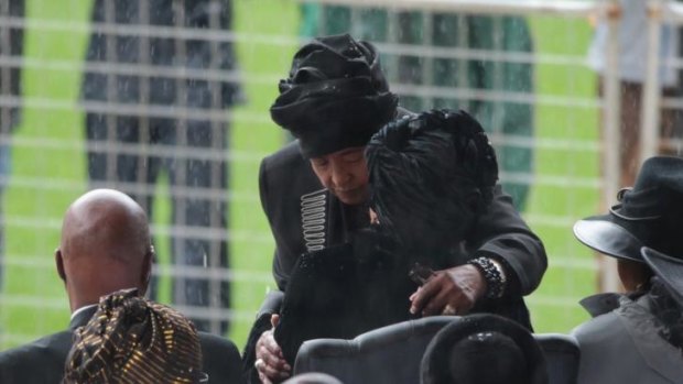 Winnie Mandela shared a long and emotional embrace with Nelson Mandela's widow, Graca Machel (seated).