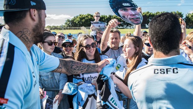 Gagged: Andrew Fifita, left, with Cronulla supporters.