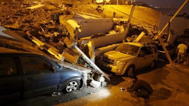 Cars caught under rubble after the earthquake that hit Chile on Tuesday.