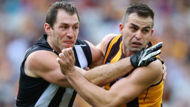 Brian Lake, seen here grappling with Magpie Travis Cloke, may need to regain match fitness before he plays.