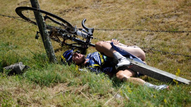 Netherland's Johnny Hoogerland after he crashed and landed in a fence at the side of the road during the ninth stage of the 2011 Tour de France.