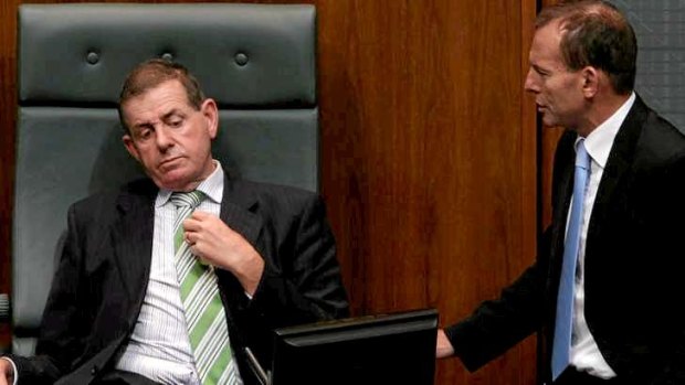 Tony Abbott speaks to Peter Slipper in 2011.