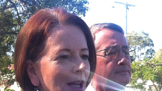 Prime Minister Julia Gillard visited a playground in Brisbane on Sunday, May 13, accompanied by Treasurer Wayne Swan to promote the federal government's kids' bonus.