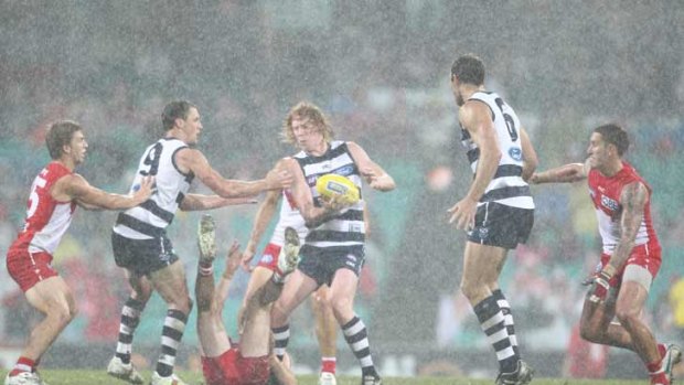 Geelong overcame difficult conditions and a dogged Sydney in round four.