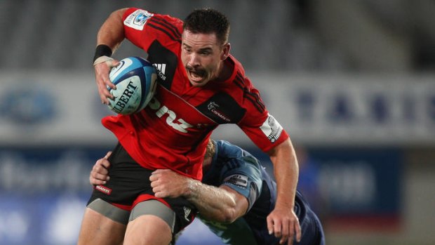 Nabbed ... Ryan Crotty of the Crusaders is tackled as he attempts to slice through a gap.