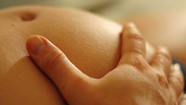 A caring touch: relaxing can help relieve pain during childbirth.