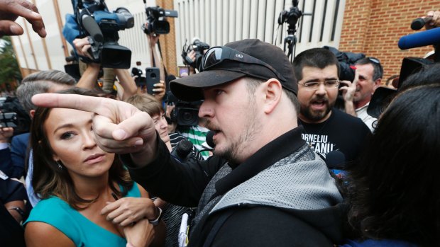 Matthew Parrott takes issue with the media after a court hearing for James Alex Fields jnr in Charlottesville on August 14. To his right is Matthew Heimbach, who leads the white nationalist Traditionalist Worker Party.