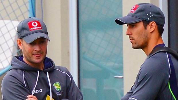 Best for the team ... captain Michael Clarke speaks with Mitchell Johnson during a Hobart training session.