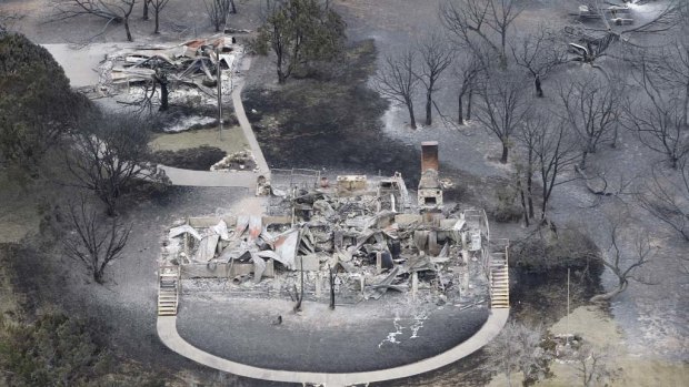 This aerial photograph shows the wreckage of a large home at  Possum Kingdom Lake.