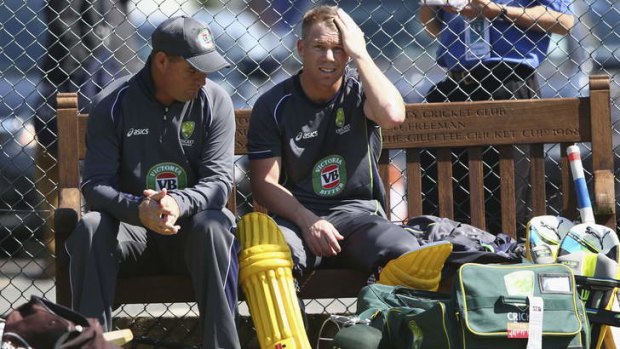 In strife: David Warner in discussion with coach Mickey Arthur during Australia's nets session at Edgbaston.