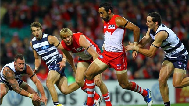 Best foot forward: Sydney star Adam Goodes attempts to kick the ball against Geelong last night.