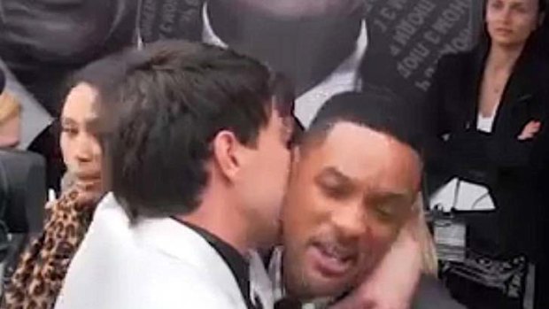 Getting fresh with the prince ... a big kiss for Will Smith.
