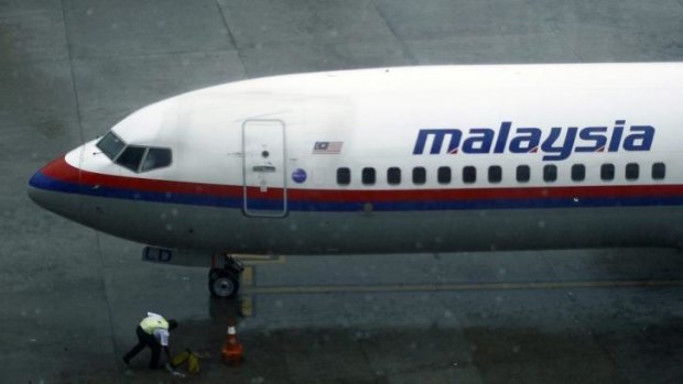 Safety considerations: A ground staff works near a Malaysia Airlines aircraft at the Kuala Lumpur International Airport this week.