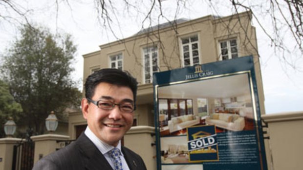 Auctioneer Robert Ding outside a house in Balwyn.