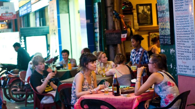 Customers at a restaurant on Sisowath Quay.