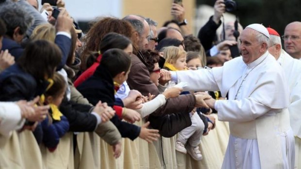 The pontiff greets the crowds during the Holy Thursday celebrations.