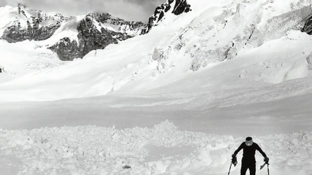 Climber Andy Henderson searches for gear lost in an avalanche during the 1984 expedition.