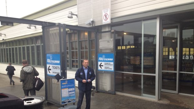 Stiff competition: Former prime minister Tony Abbott chasing the commuter vote at Manly wharf.