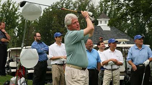 Adrift in the midrift ... a fuller figured Bill Clinton tees off two years ago.