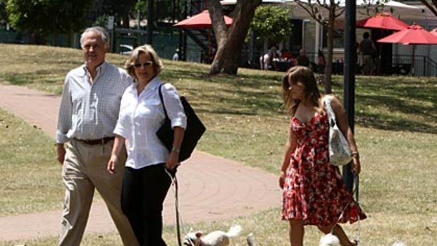 Leader or lame dog... an embattled Malcolm Turnbull walks with his wife Lucy, daughter Daisy and their dogs in Sydney yesterday.