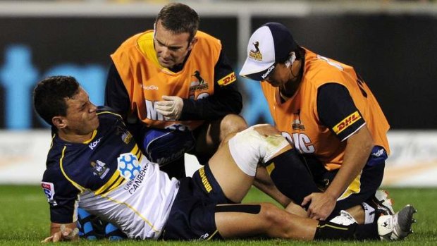 Matt Toomua of the Brumbies is forced off with a knee injury.