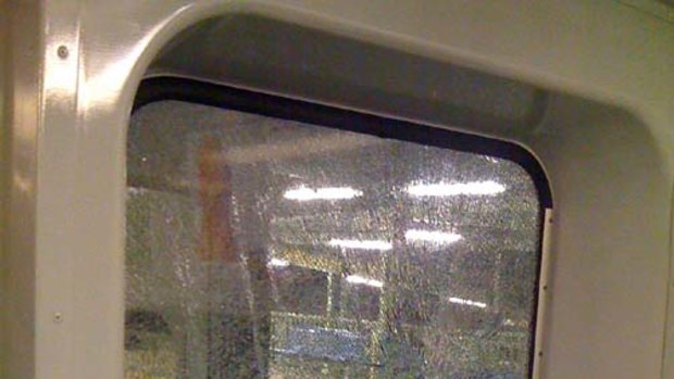 Close call...a male passenger was knocked from his seat after a rock smashed a train window.