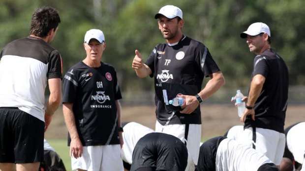 Tony Popovic directs a Wanderers training session.