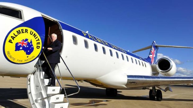Clive Palmer boards his private jet at Canberra headed for Perth.