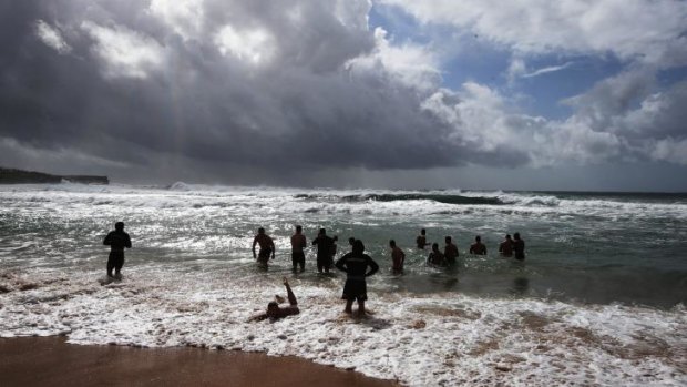 Ice bath: Souths players recover in the surf at Maroubra Beach on Friday.