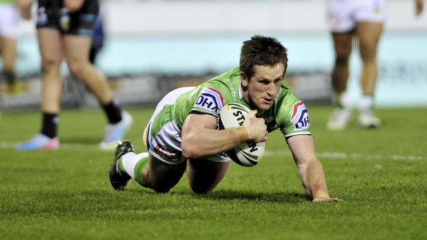 Raiders half Josh McCrone scores a try in the first half.